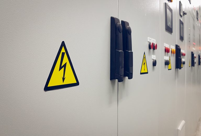 Sign dangerous voltage on the electrical panel.